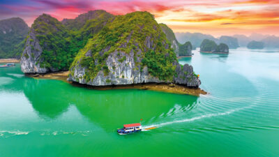 Halong Bay is a magical world of emerald-green waters, karst mountains and floating villages