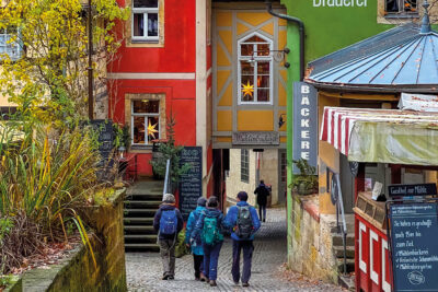 Tourists walking down the street in Schmilka, Germany