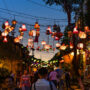 Street night time view of Old Town Hoi An with lanterns hanging above